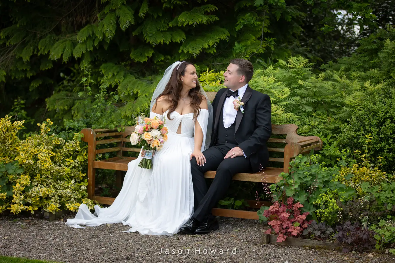 Bride and groom in the gardens at Rowton Hall Hotel, Cheshire