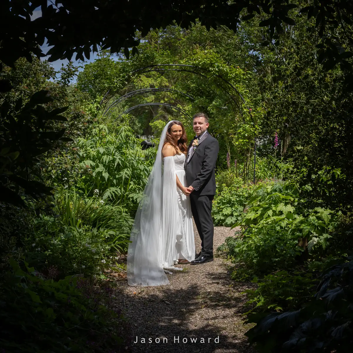 Bride and groom wedding photo in the grounds of Rowton Hall Hotel, Chester