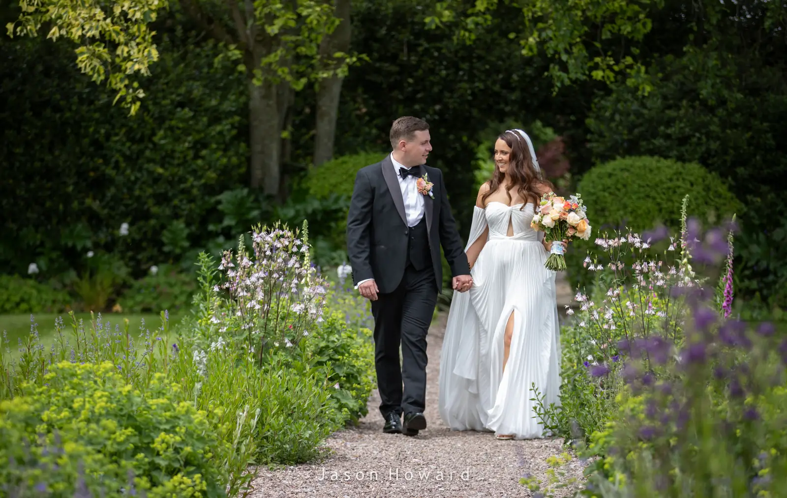 Bride in the gardens at a Rowton Hall Hotel wedding, Chester