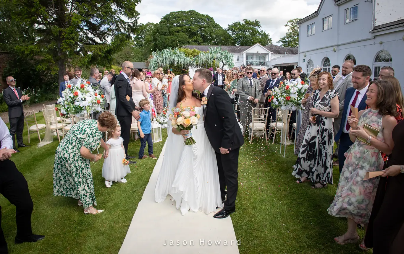 Bride walking down the aisle at Rowton Hall Hotel, Chester